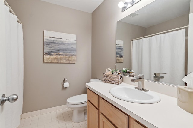 bathroom featuring tile patterned flooring, vanity, toilet, baseboards, and visible vents