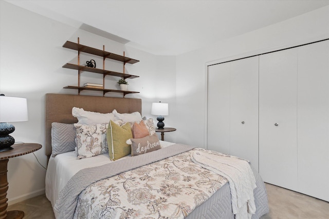 bedroom featuring carpet and a closet