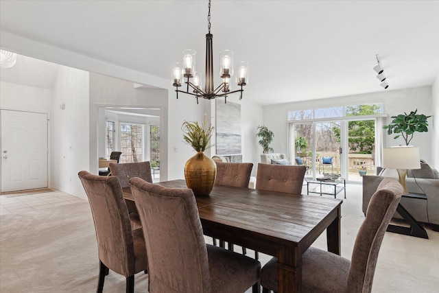 dining space with an inviting chandelier and plenty of natural light