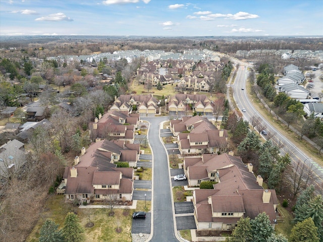 birds eye view of property with a residential view