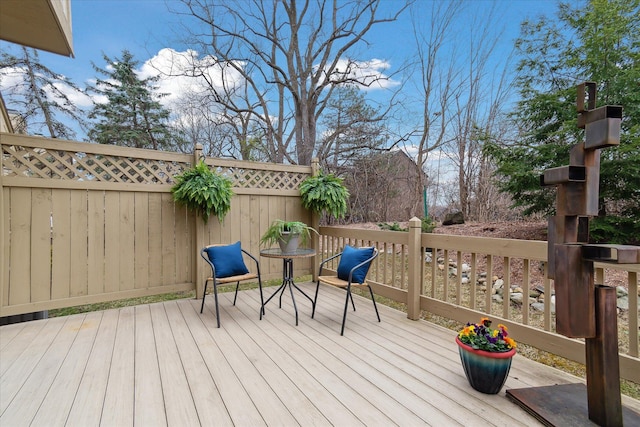 wooden deck featuring fence