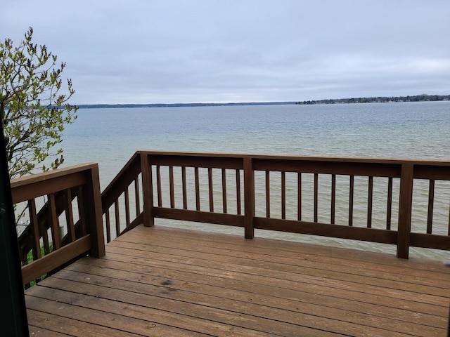 wooden terrace with a water view
