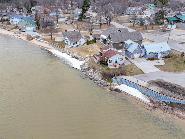 birds eye view of property with a residential view and a water view