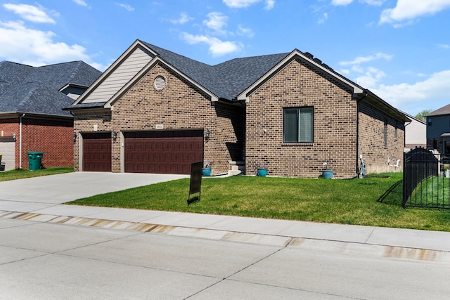 view of front of house featuring an attached garage, concrete driveway, a front lawn, and brick siding
