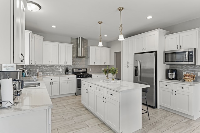 kitchen with tasteful backsplash, stainless steel appliances, recessed lighting, and wall chimney exhaust hood