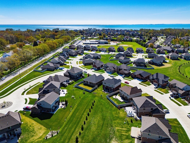 aerial view featuring a residential view and a water view