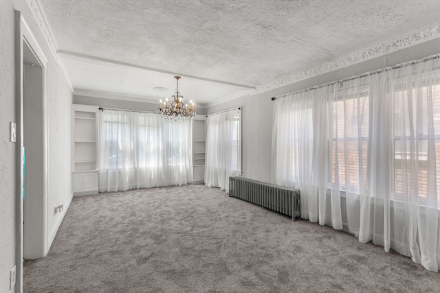 8735 Marygrove Dr, Detroit, MI 48221 - unfurnished room with an inviting chandelier, ornamental molding, a textured ceiling, carpet floors, and radiator heating unit