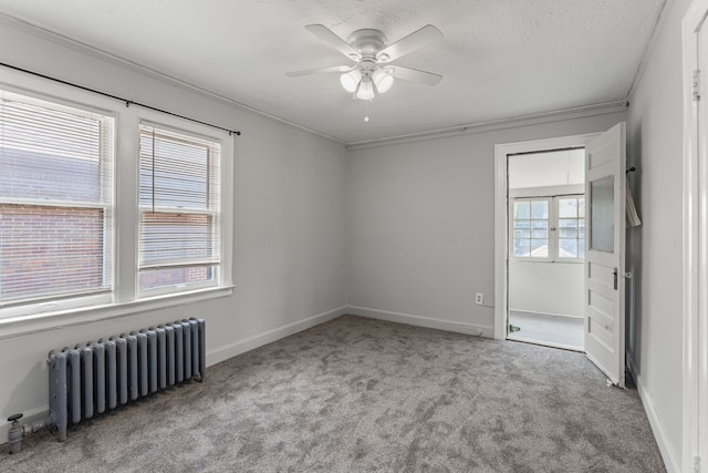 8735 Marygrove Dr, Detroit, MI 48221 - unfurnished bedroom with a textured ceiling, radiator, carpet flooring, and baseboards