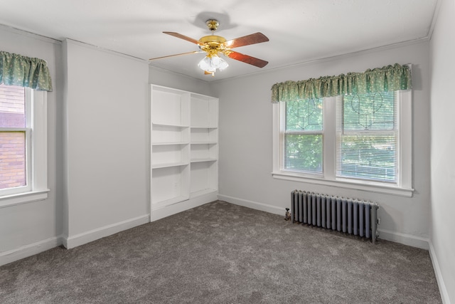 8735 Marygrove Dr, Detroit, MI 48221 - spare room featuring radiator heating unit, carpet flooring, ceiling fan, and baseboards