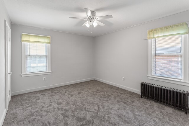 8735 Marygrove Dr, Detroit, MI 48221 - carpeted empty room with radiator, ceiling fan, baseboards, and ornamental molding