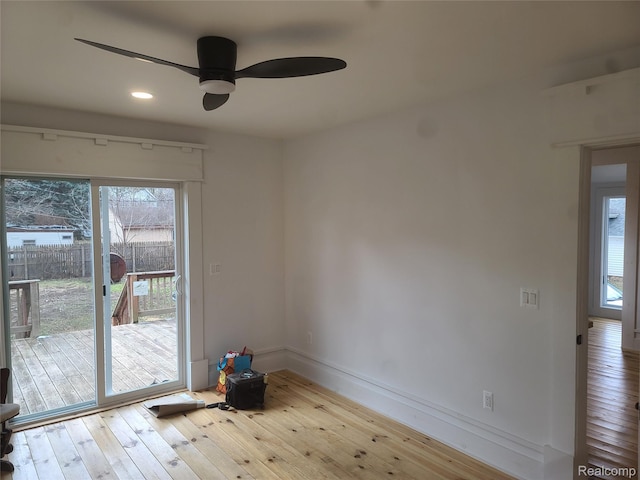 3685 Main St, Akron, MI 48701 - empty room with a ceiling fan, healthy amount of natural light, hardwood / wood-style floors, baseboards, and recessed lighting