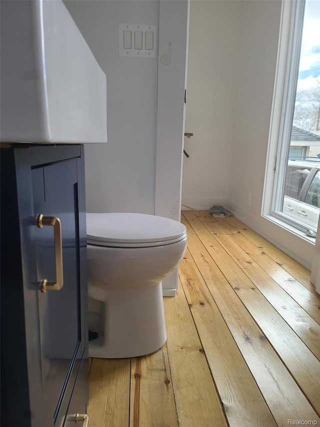 3685 Main St, Akron, MI 48701 - bathroom featuring wood-type flooring and toilet