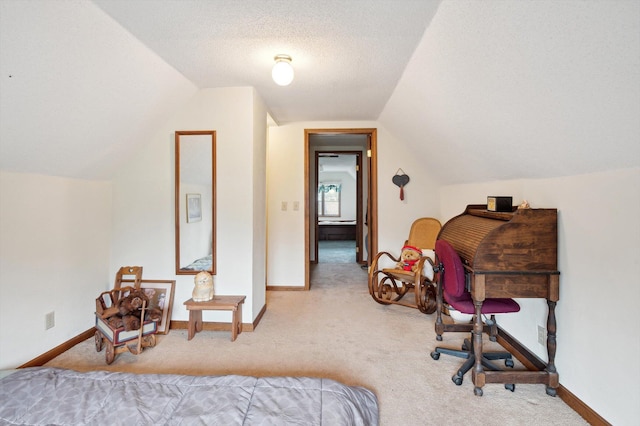bedroom featuring carpet floors, baseboards, vaulted ceiling, and a textured ceiling