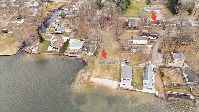 drone / aerial view with a residential view and a water view