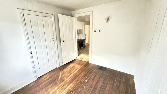 508 Humphrey St, Monroe, MI 48161 - unfurnished bedroom with dark wood-type flooring and a closet