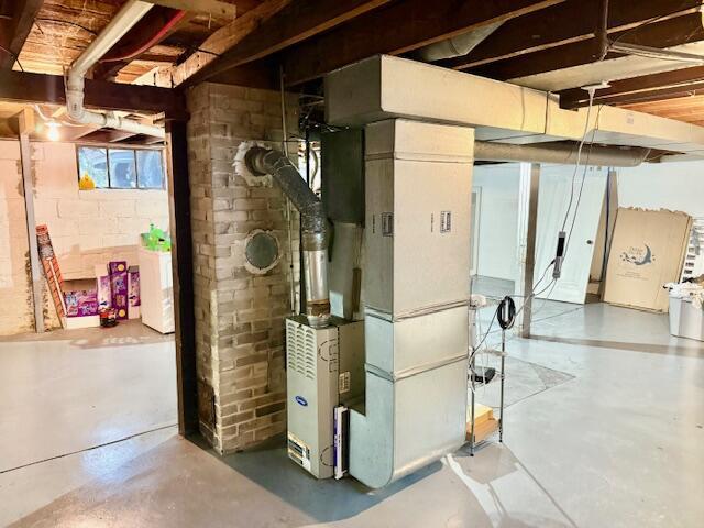 1024 Madison St, Muskegon, MI 49442 - below grade area with concrete block wall and heating unit
