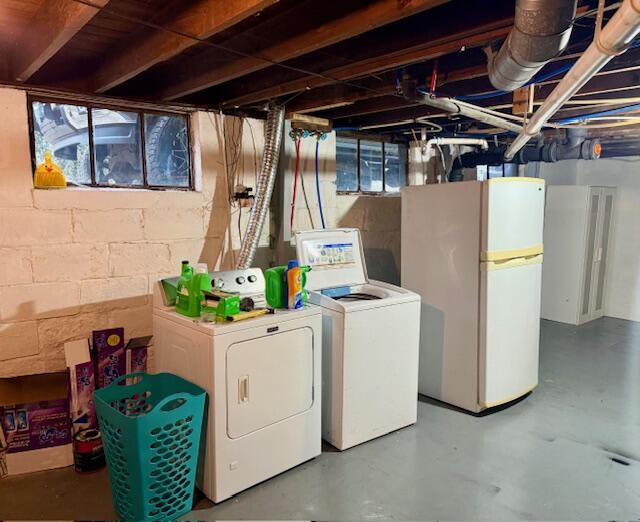 1024 Madison St, Muskegon, MI 49442 - below grade area featuring freestanding refrigerator and washing machine and clothes dryer