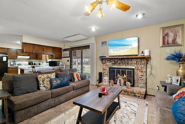 living room featuring a fireplace and ceiling fan