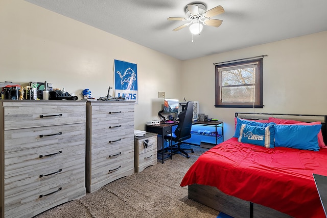bedroom with a textured ceiling, ceiling fan, and carpet