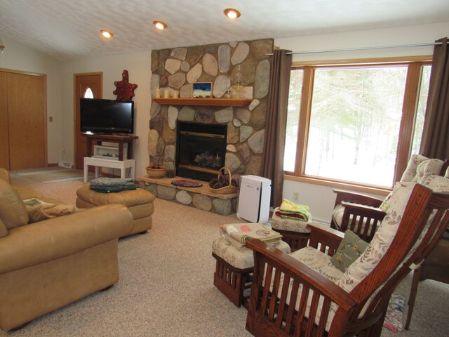 living area with a fireplace, recessed lighting, carpet, and vaulted ceiling