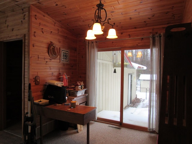 home office featuring lofted ceiling, carpet, wood ceiling, wooden walls, and visible vents