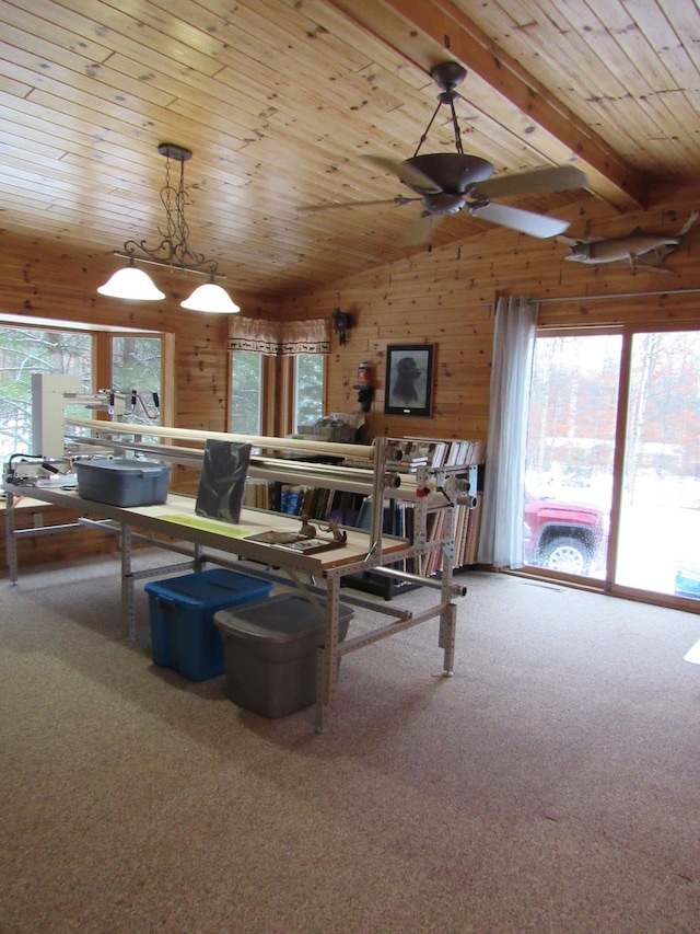 carpeted living room featuring wooden ceiling, wooden walls, vaulted ceiling, and ceiling fan