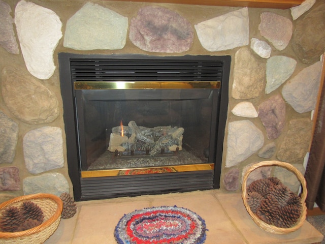 details with a stone fireplace