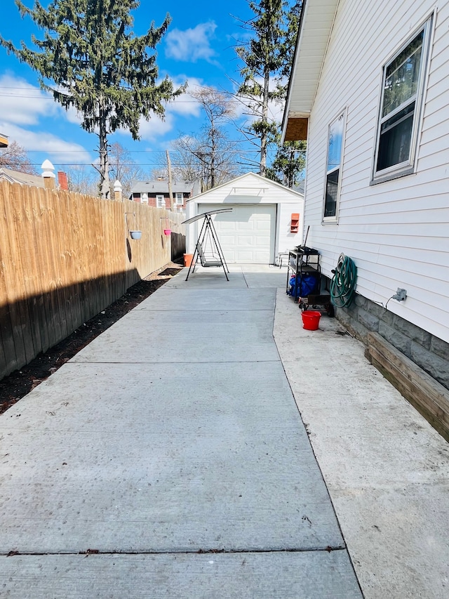 1702 Copeman Blvd, Flint, MI 48504 - exterior space featuring fence, an outbuilding, and a detached garage