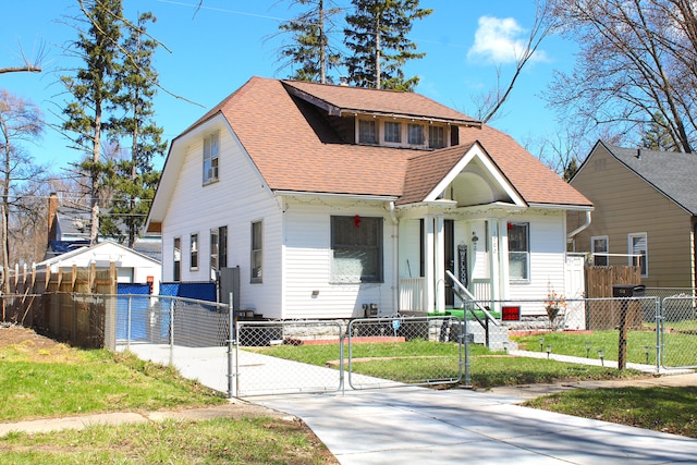 1702 Copeman Blvd, Flint, MI 48504 - view of front of property with a fenced front yard, a gate, a front lawn, concrete driveway, and a shingled roof