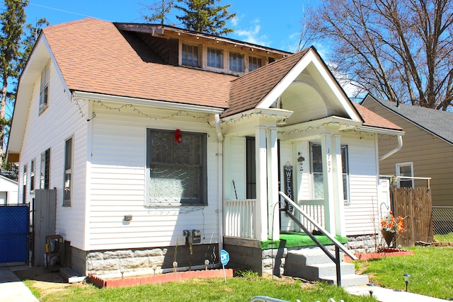 1702 Copeman Blvd, Flint, MI 48504 - view of front facade featuring fence and a shingled roof