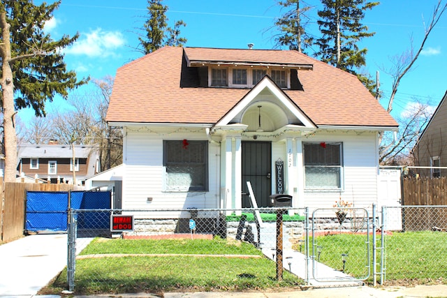 1702 Copeman Blvd, Flint, MI 48504 - bungalow-style house featuring a gate, a fenced front yard, and a front lawn