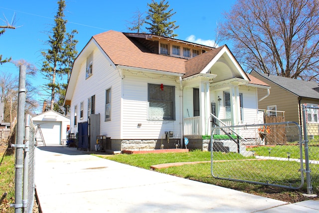 1702 Copeman Blvd, Flint, MI 48504 - bungalow-style home with driveway, roof with shingles, an outbuilding, a garage, and fence