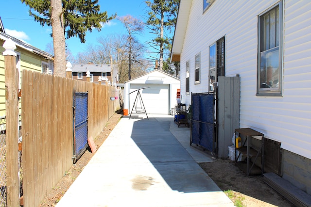 1702 Copeman Blvd, Flint, MI 48504 - view of property exterior featuring an outdoor structure, a garage, and fence