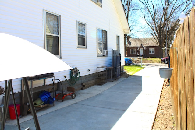 1702 Copeman Blvd, Flint, MI 48504 - view of side of property featuring fence and a patio area