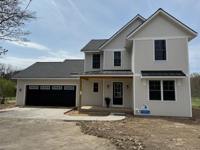 modern farmhouse style home with covered porch, a standing seam roof, roof with shingles, concrete driveway, and an attached garage