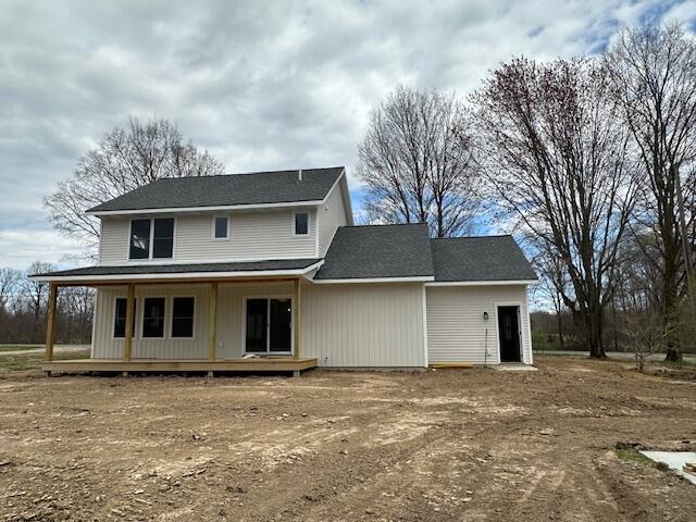 rear view of house with a porch