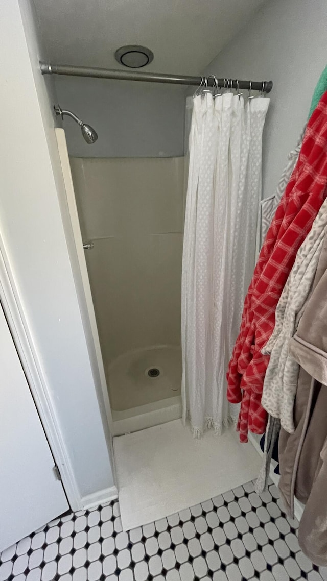12181 Trail Creek Dr, Stanwood, MI 49346 - bathroom with a shower stall and tile patterned floors