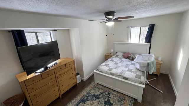 12181 Trail Creek Dr, Stanwood, MI 49346 - bedroom with dark wood finished floors, baseboards, a ceiling fan, and a textured ceiling