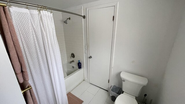 12181 Trail Creek Dr, Stanwood, MI 49346 - bathroom featuring shower / bath combo with shower curtain, toilet, and tile patterned floors