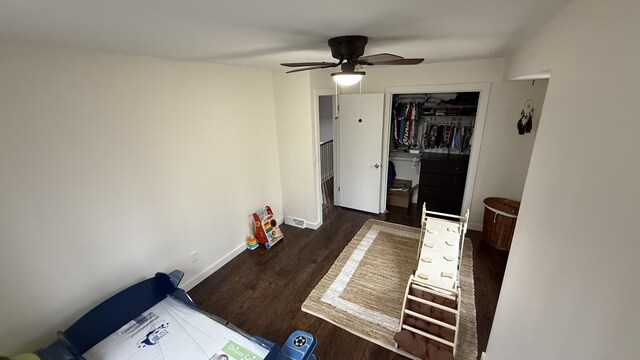 12181 Trail Creek Dr, Stanwood, MI 49346 - bedroom with baseboards, a closet, wood finished floors, and ceiling fan