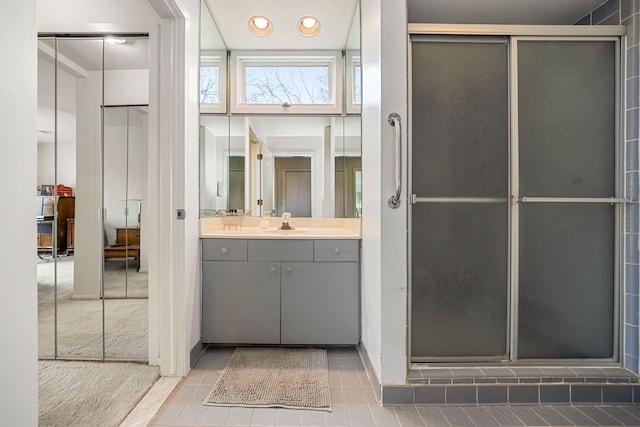 full bath with vanity, tile patterned flooring, recessed lighting, and a shower stall