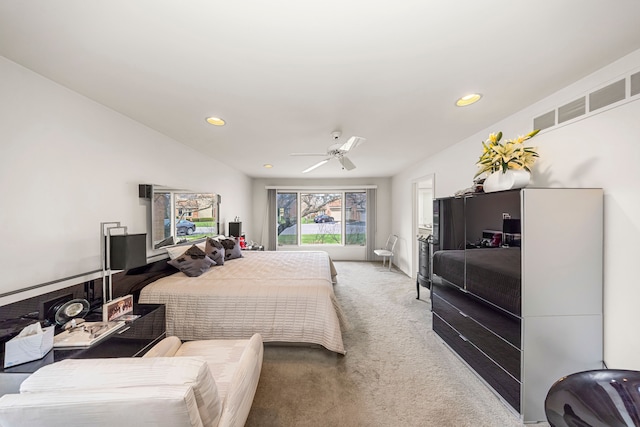 carpeted bedroom with visible vents, recessed lighting, and a ceiling fan