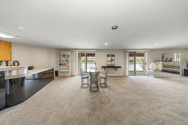 carpeted dining area featuring recessed lighting and plenty of natural light