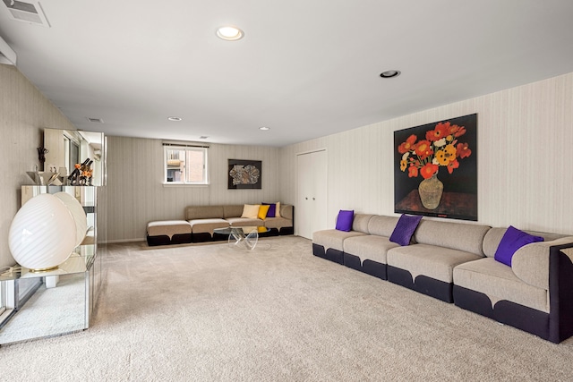 living area featuring carpet floors, visible vents, and recessed lighting