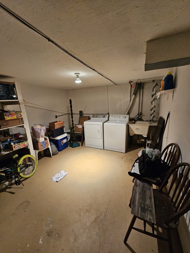 13940 Camelot Dr Unit 79, Sterling Heights, MI 48312 - garage featuring a sink and washing machine and dryer