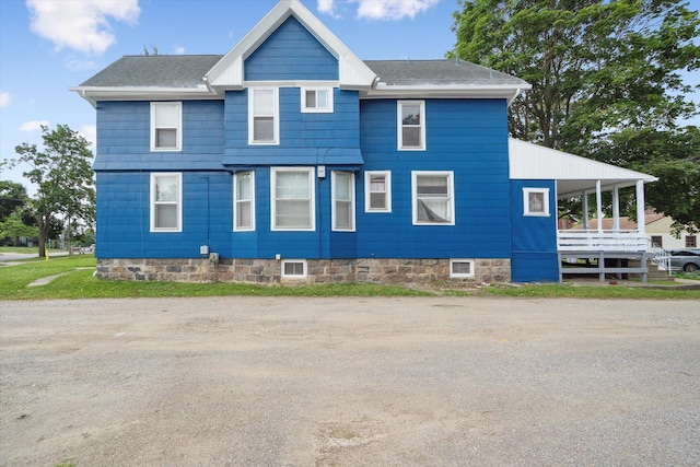 612 Lansing Ave, Jackson, MI 49202 - view of side of home featuring a shingled roof