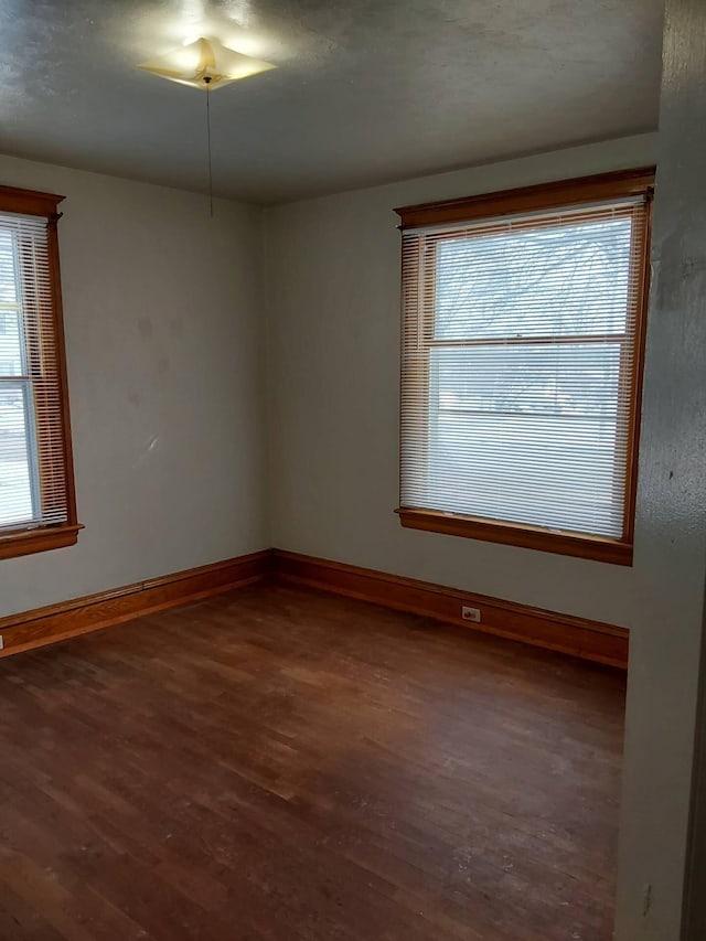 612 Lansing Ave, Jackson, MI 49202 - unfurnished room with wood finished floors and healthy amount of natural light