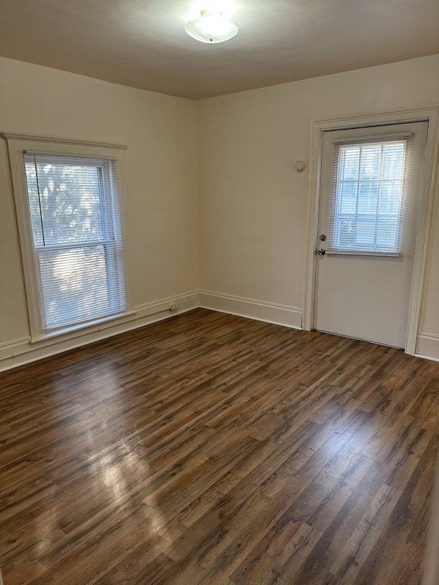 612 Lansing Ave, Jackson, MI 49202 - spare room featuring dark wood finished floors