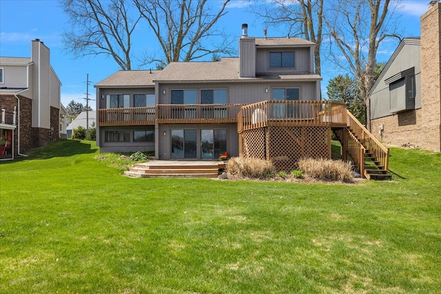 back of property featuring a lawn, a wooden deck, stairs, and a chimney