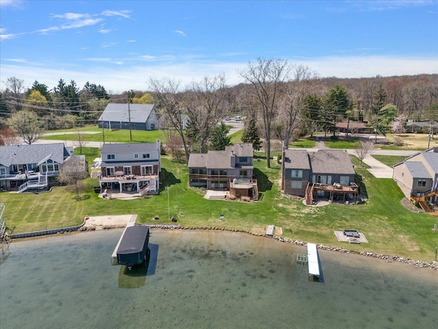 bird's eye view with a water view and a residential view